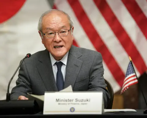 Japan closely watching stock moves but is not in a phase of action, finance minister says