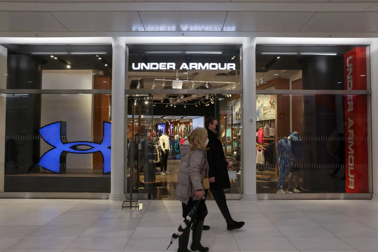 People walk by an Under Armour store in Manhattan, New York City