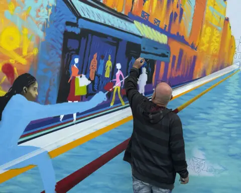 Street art pops up throughout Paris, adding some Olympic color to major landmarks