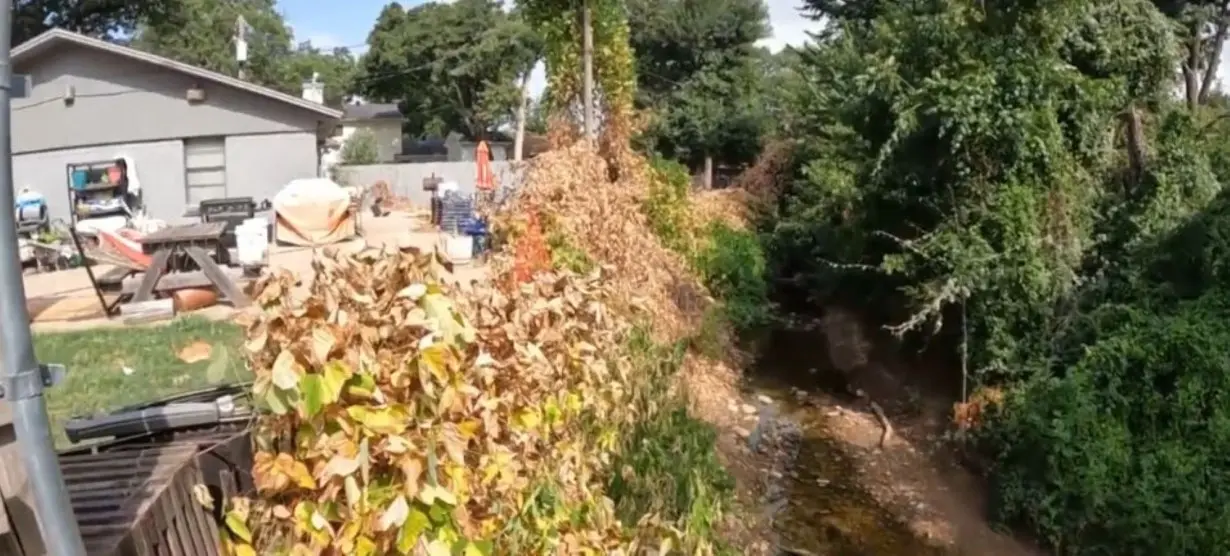 Woman watches backyard disappear after city says erosion is her problem