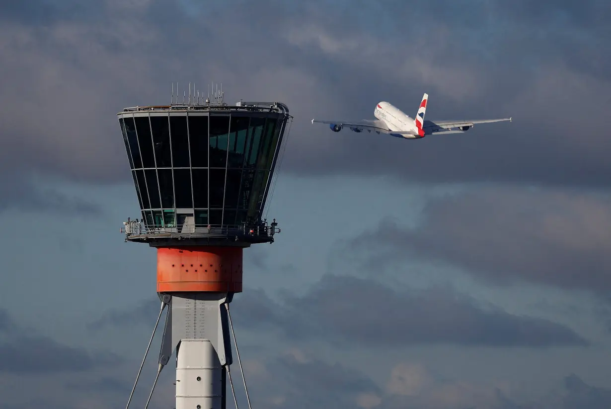 FILE PHOTO: A British Airways Airbus A380 takes off in view of the control tower at Heathrow Airport