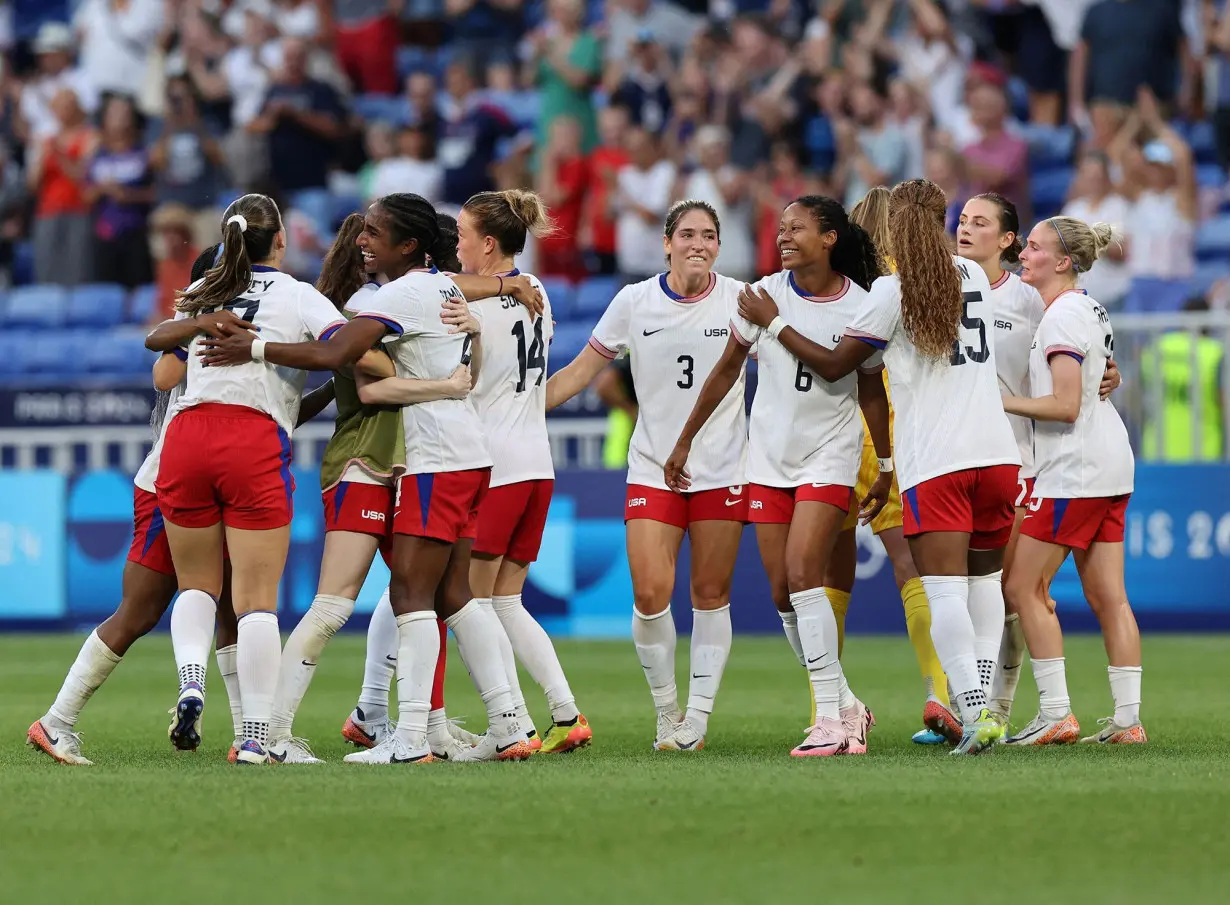 The US women's soccer team is favorited to win the final against Brazil at the Paris Olympics. In this photo, the team celebrates their late goal against Germany in the semifinal.