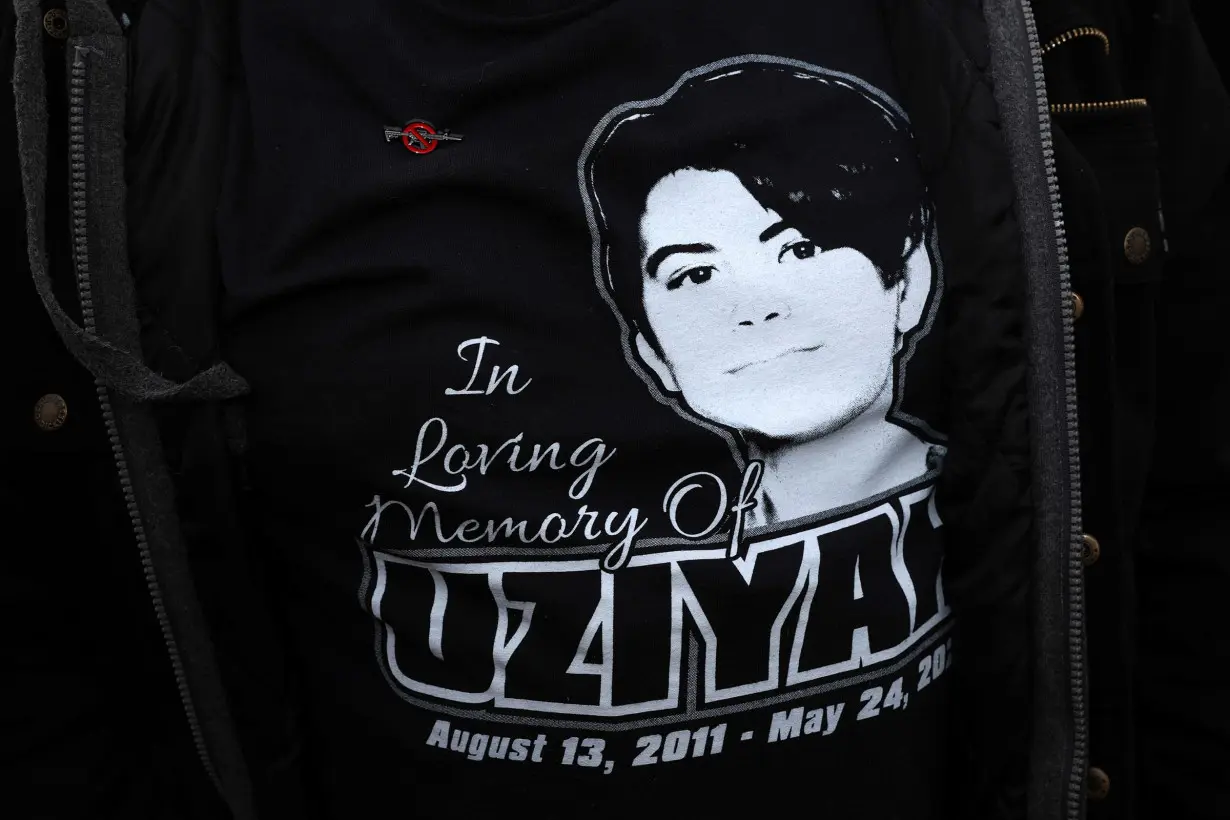 Brett Cross wears a t-shirt that features his son and Uvalde mass shooting victim, Uziyah Garcia, during a 