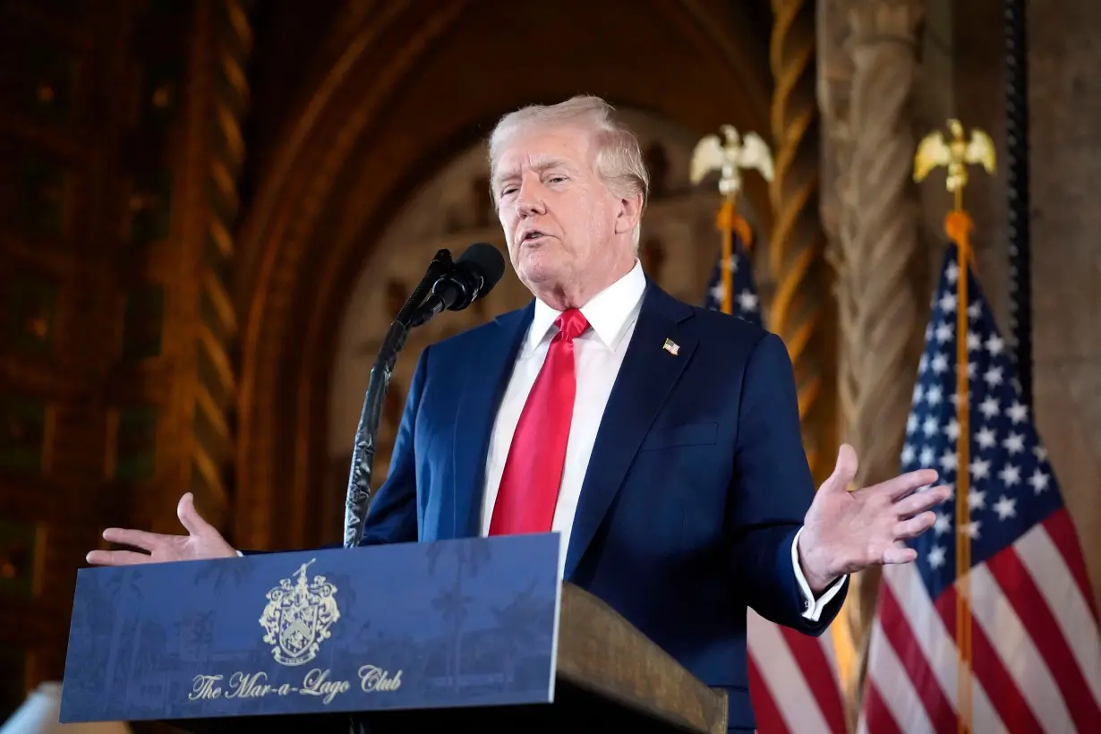 Former President Donald Trump speaks to reporters at his Mar-a-Lago estate in Palm Beach, Florida, on August 8.