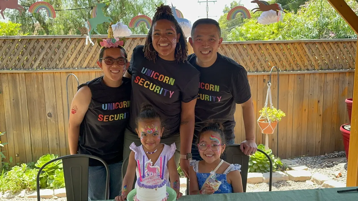 Angela Lee is pictured with her husband, Paul, along with their family, and Lee says she makes a point of teaching her daughters to embrace their full identities and steers away from using fractions to describe their heritage.