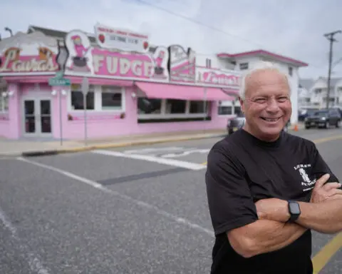 Summer tourists flock to boardwalks and piers while sticking to their budgets