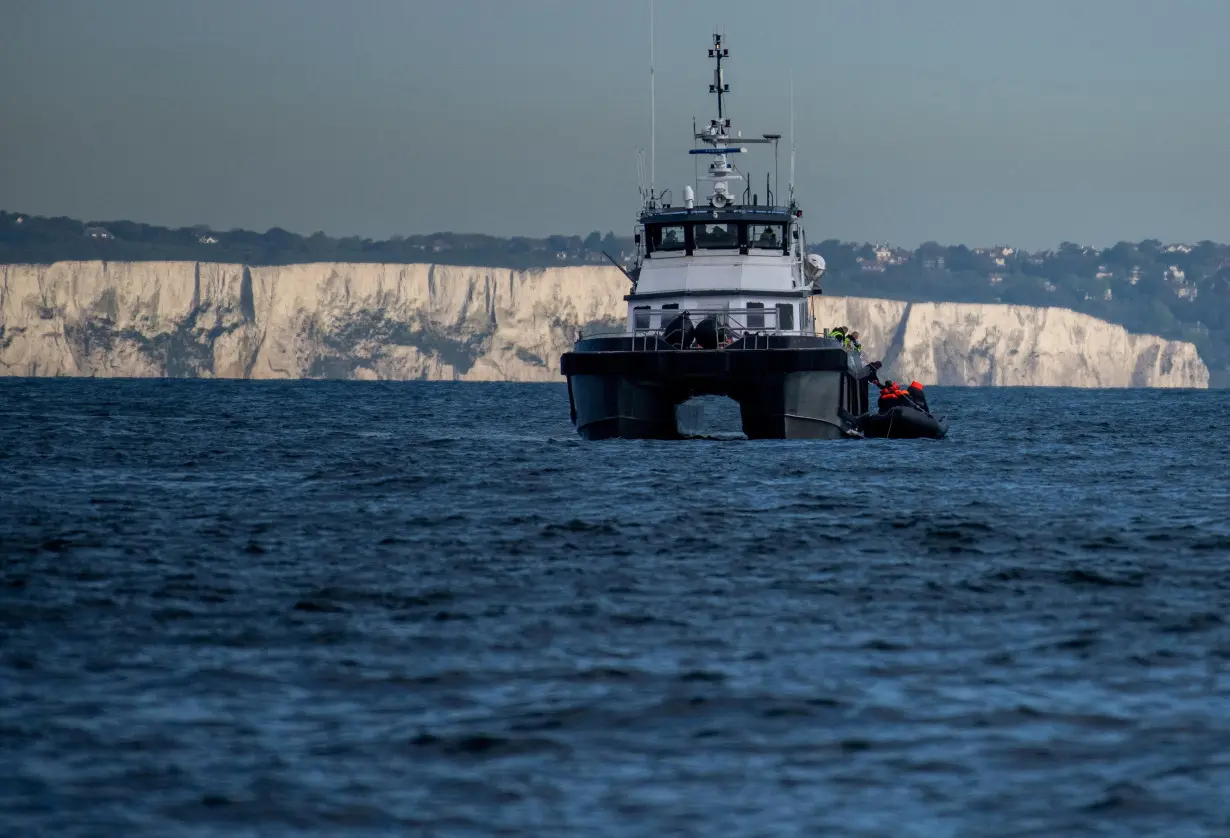 FILE PHOTO: Migrants cross the English Channel in small boats