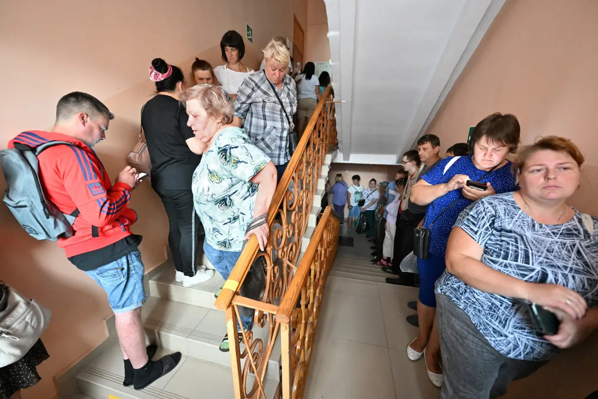 People receive humanitarian aid in Russia's Kursk