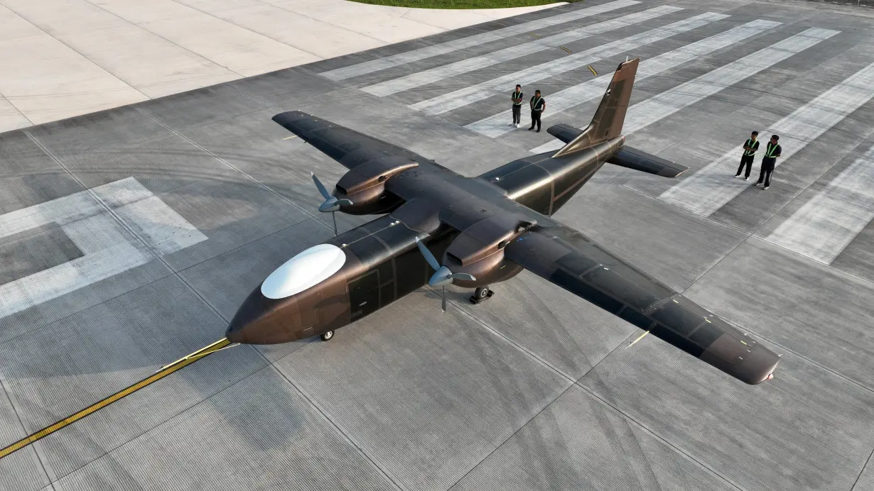 Unmanned cargo aircraft developed by Sichuan Tengden Sci-tech Innovation Co. takes part in a maiden flight at an airport in Zigong