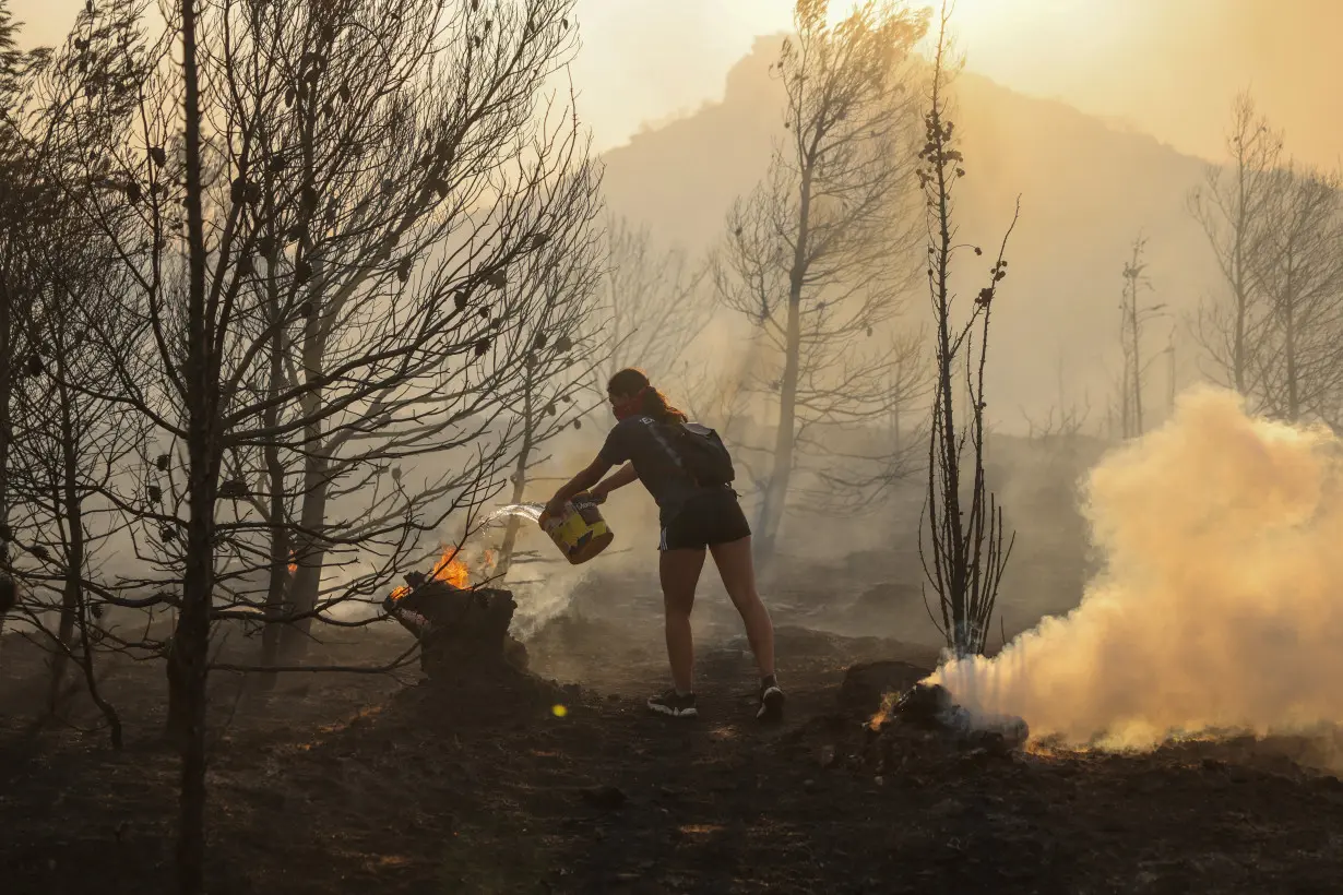 Wildfire burns in Penteli, near Athens