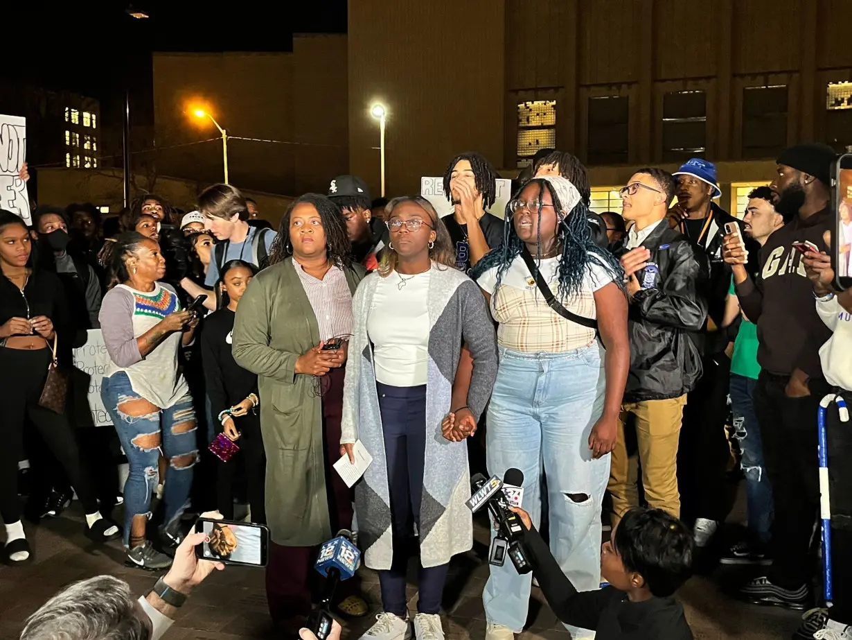 Kylah Spring, center, is seen speaking at a march against racism on University of Kentucky's campus on Monday, Nov. 7, 2022 in Lexington, Kentucky. She was working at a dorm when she was verbally attacked by a White student who was intoxicated.