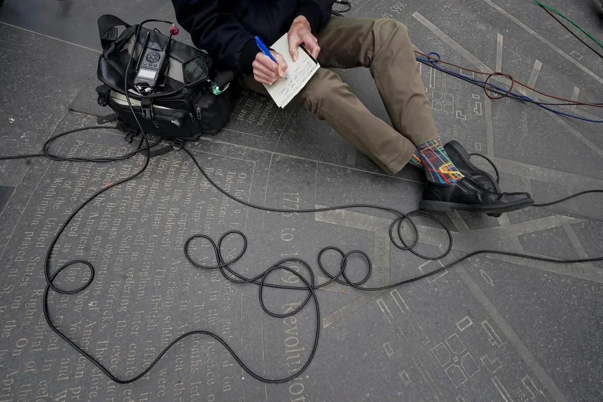 WCBS Newsradio 880 reporter Peter Haskell takes notes during a news conference in New York on March 24, 2021.