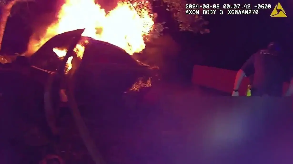 Body cam video shows heroic officers, witness rescuing driver after fiery crash