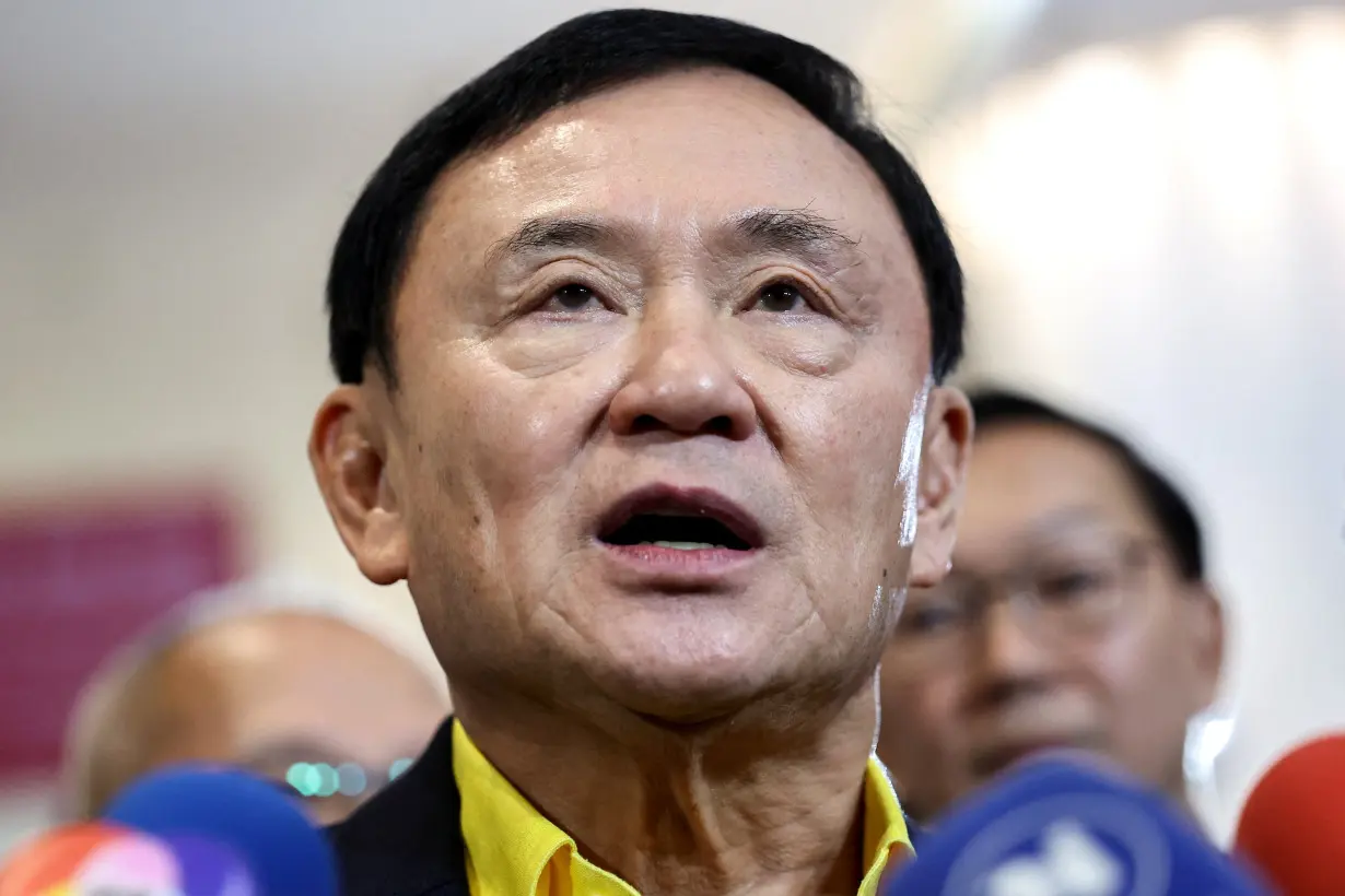 Thailand's former Prime Minister Thaksin Shinawatra speaks to members of the media as he attends THACCA SPLASH - Soft Power Forum 2024 at the Queen Sirikit National Convention Center in Bangkok