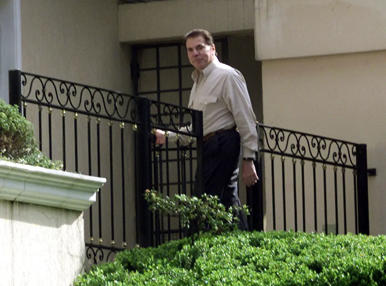 BRAZILIAN MEDIA MOGUL SANTOS IN FRONT OF HIS HOUSE IN SAO PAULO.