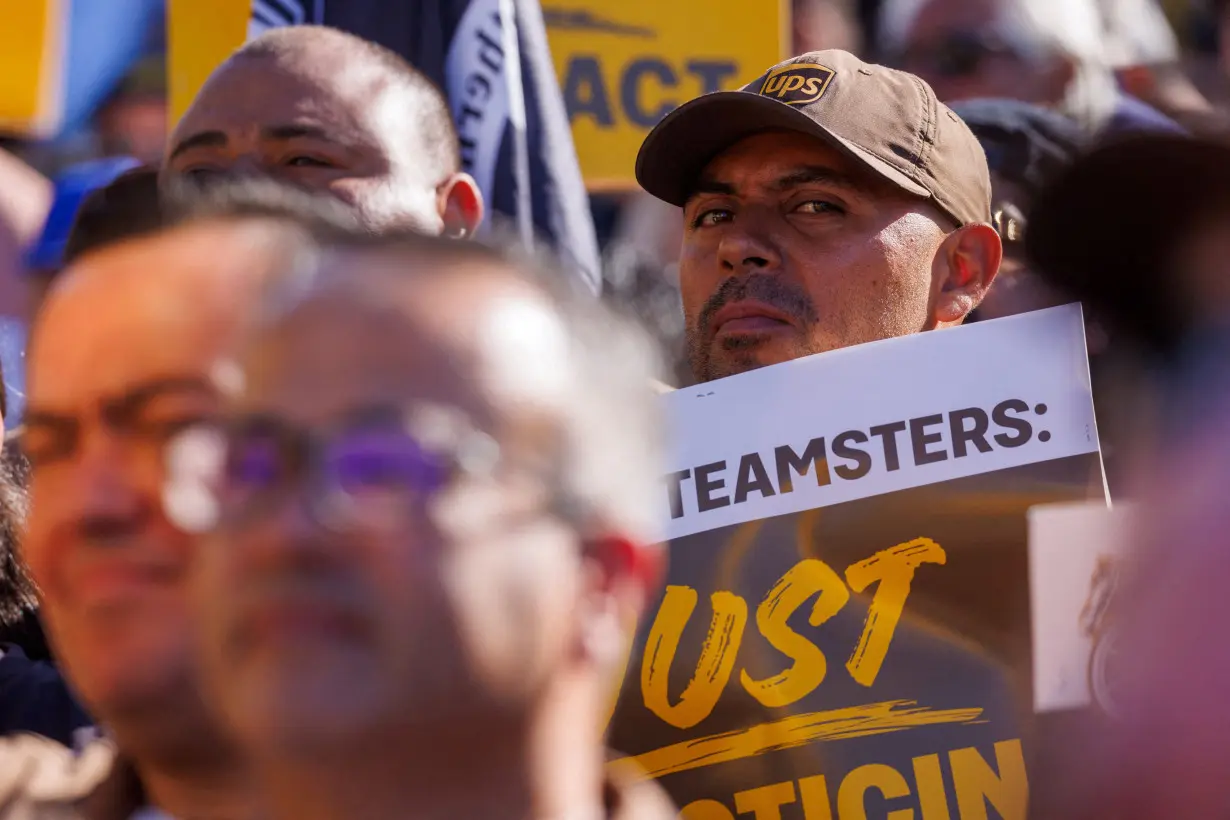 FILE PHOTO: Teamsters employed by UPS hold a rally outside a UPS facility in Los Angeles