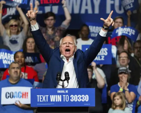 Walz touts Nebraska roots in visit to his home state where there's a battle over one electoral vote