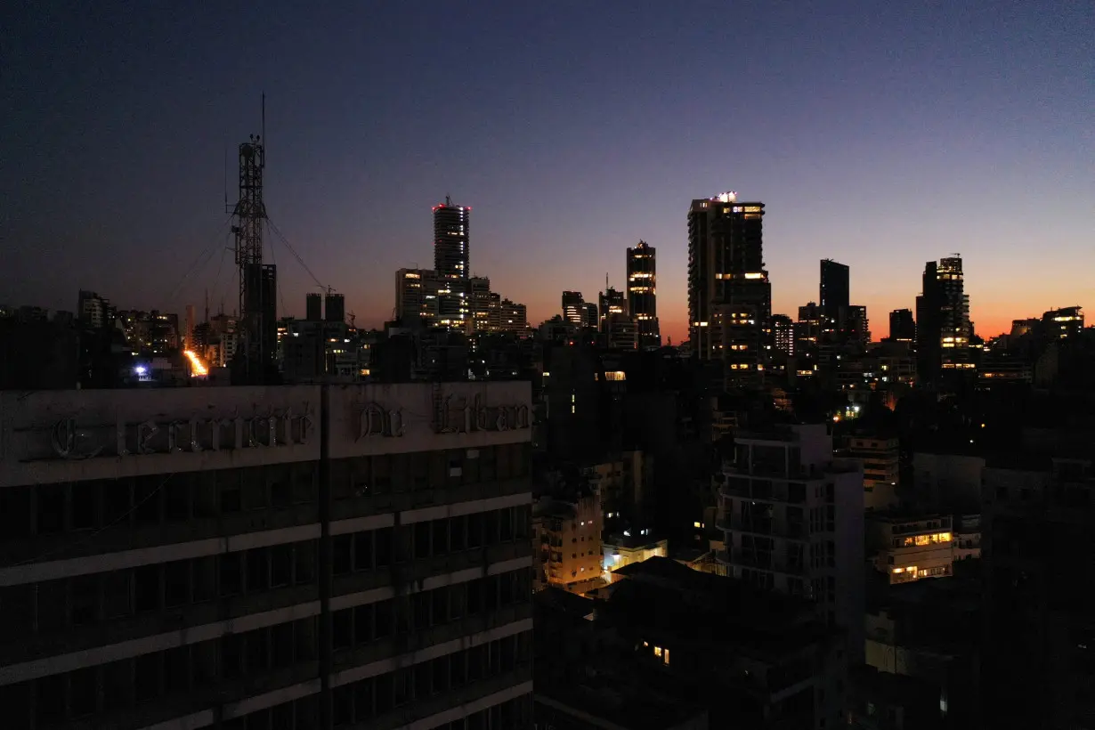 A view shows the exterior of Lebanon's Electricity Company and residential buildings during sunset, in Beirut