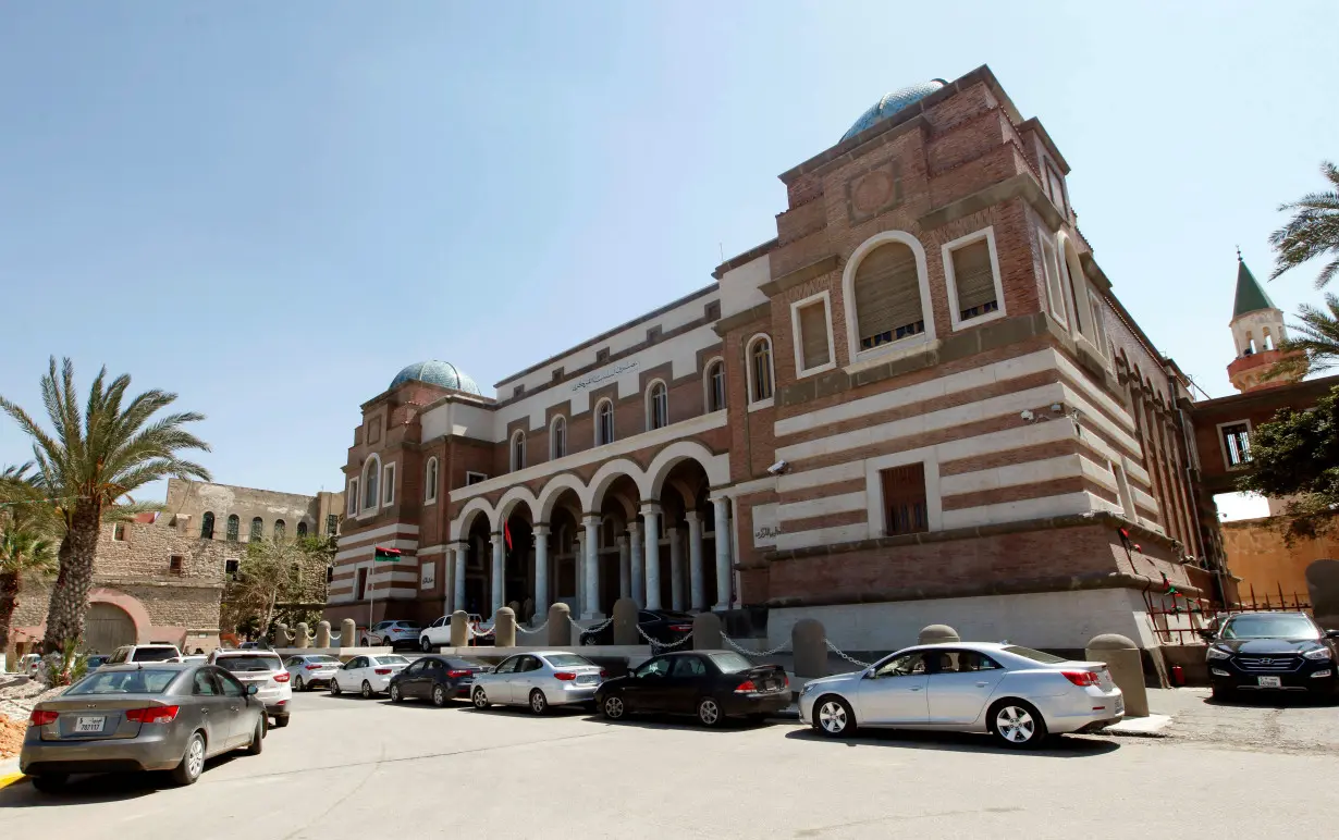 Cars are parked outside the Central Bank of Libya in Tripoli, Libya