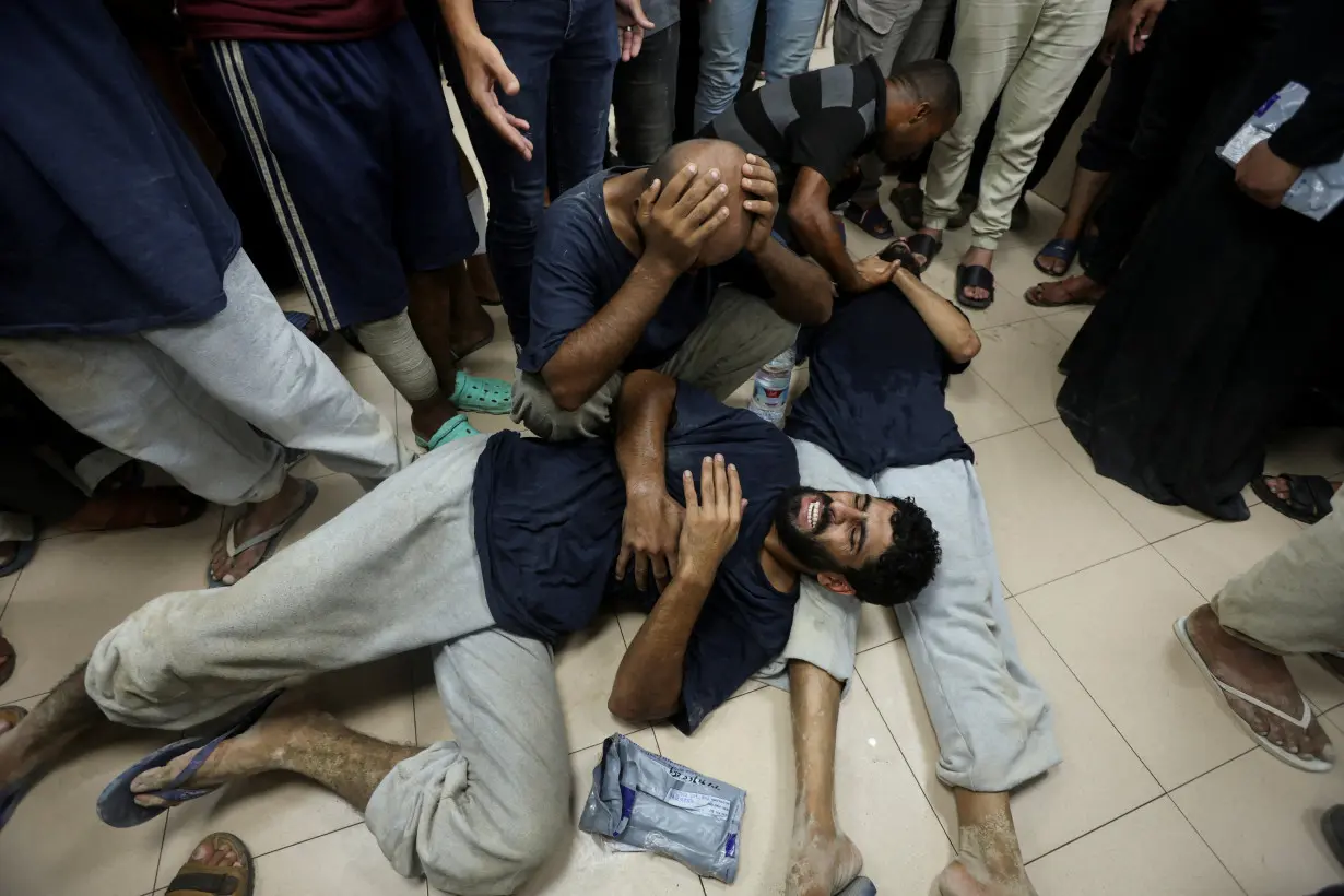 Palestinians who were detained by Israel arrive at Al-Aqsa Martyrs Hospital following their release, in Deir Al-Balah in the central Gaza Strip