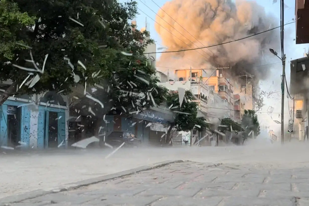 Smoke rises following an Israeli strike on a residential building, in Nuseirat in the central Gaza Strip