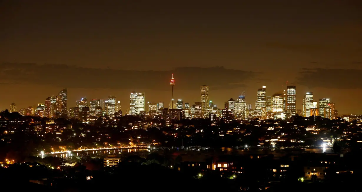 FILE PHOTO: Sydney's central business district lights up after sunset