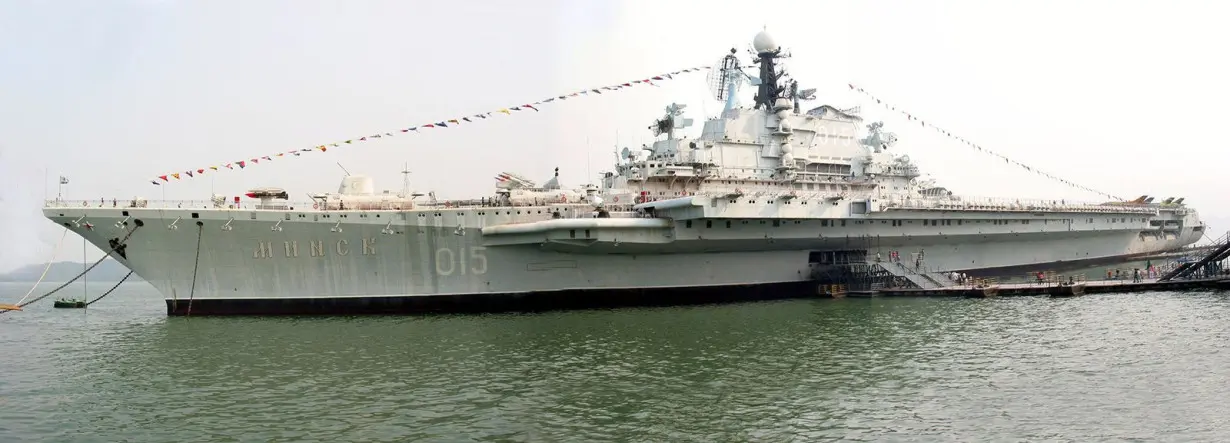 Old aircraft carrier, once part of mighty Soviet fleet, burns in Chinese lagoon