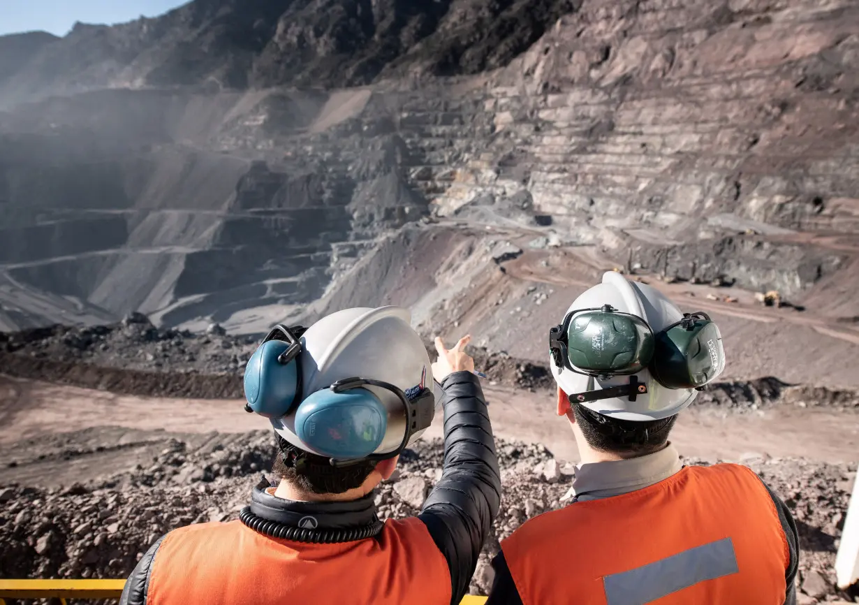 Two men stand at Anglo American's El Soldado copper mine in Chile