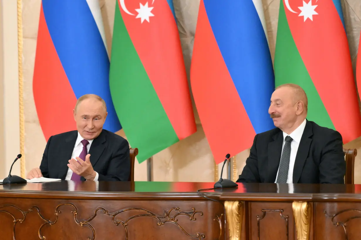 Russia's President Putin and Azerbaijan's President Aliyev attend a press conference in Baku