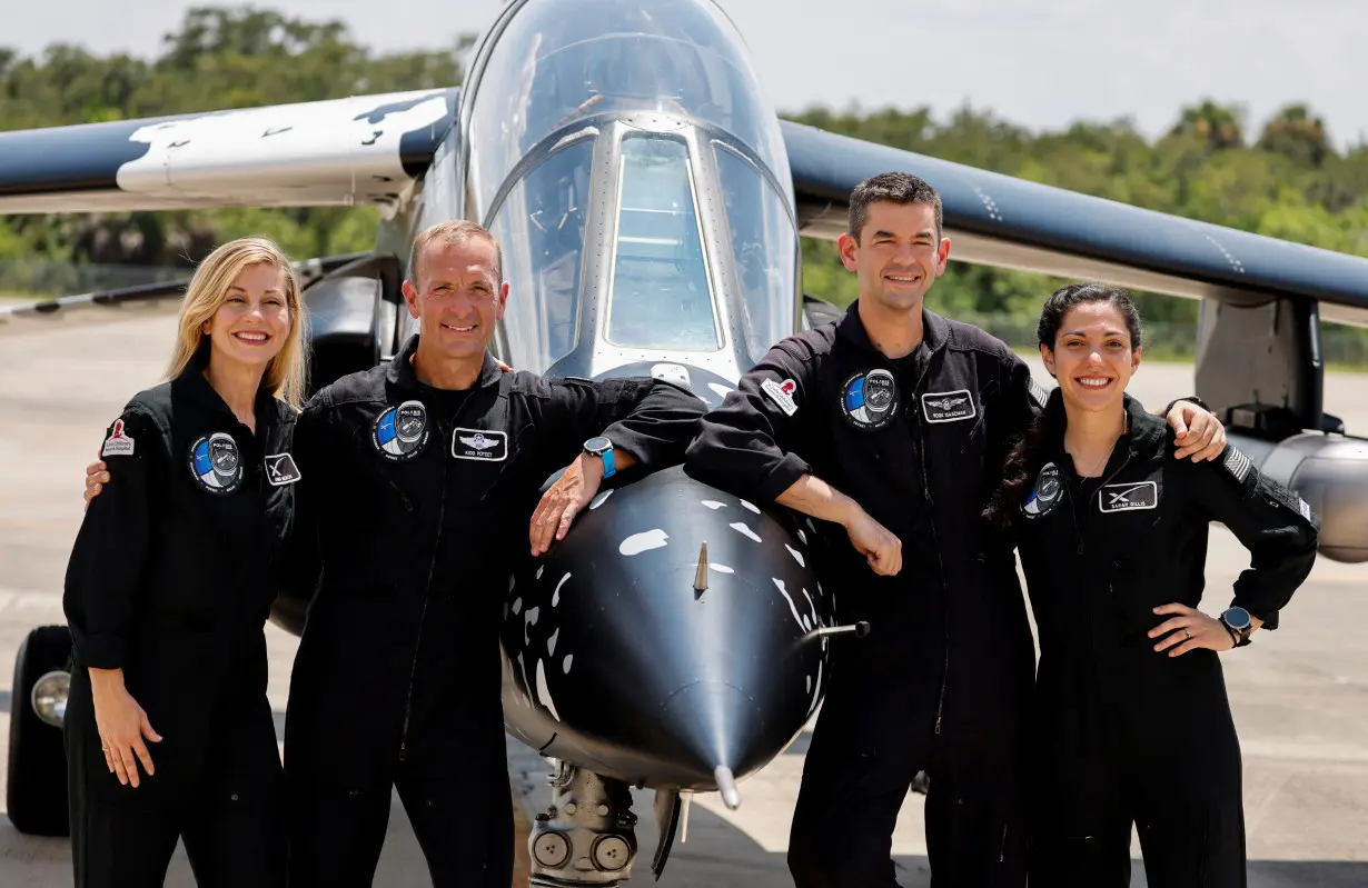 Crew members of Polaris Dawn attend a press conference at the Kennedy Space Center in Cape Canaveral