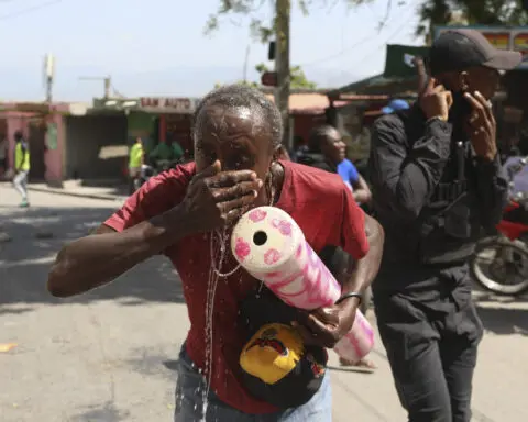 Haitian police tear-gas peaceful protesters as they demand help in stopping gangs