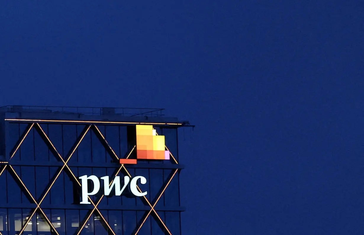 FILE PHOTO: The logo of PwC is seen on the top of a Brussels' office of the company