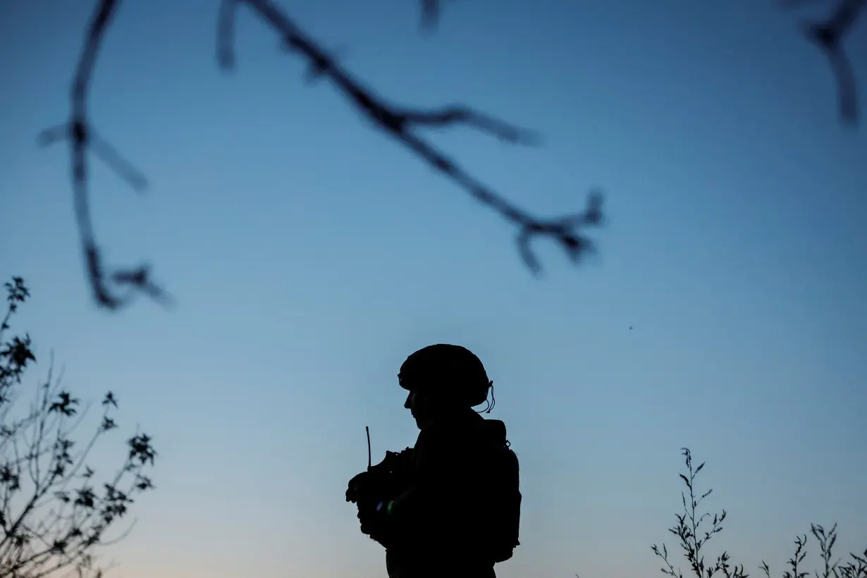 Ukrainian service members attend military drills near a frontline in Donetsk region