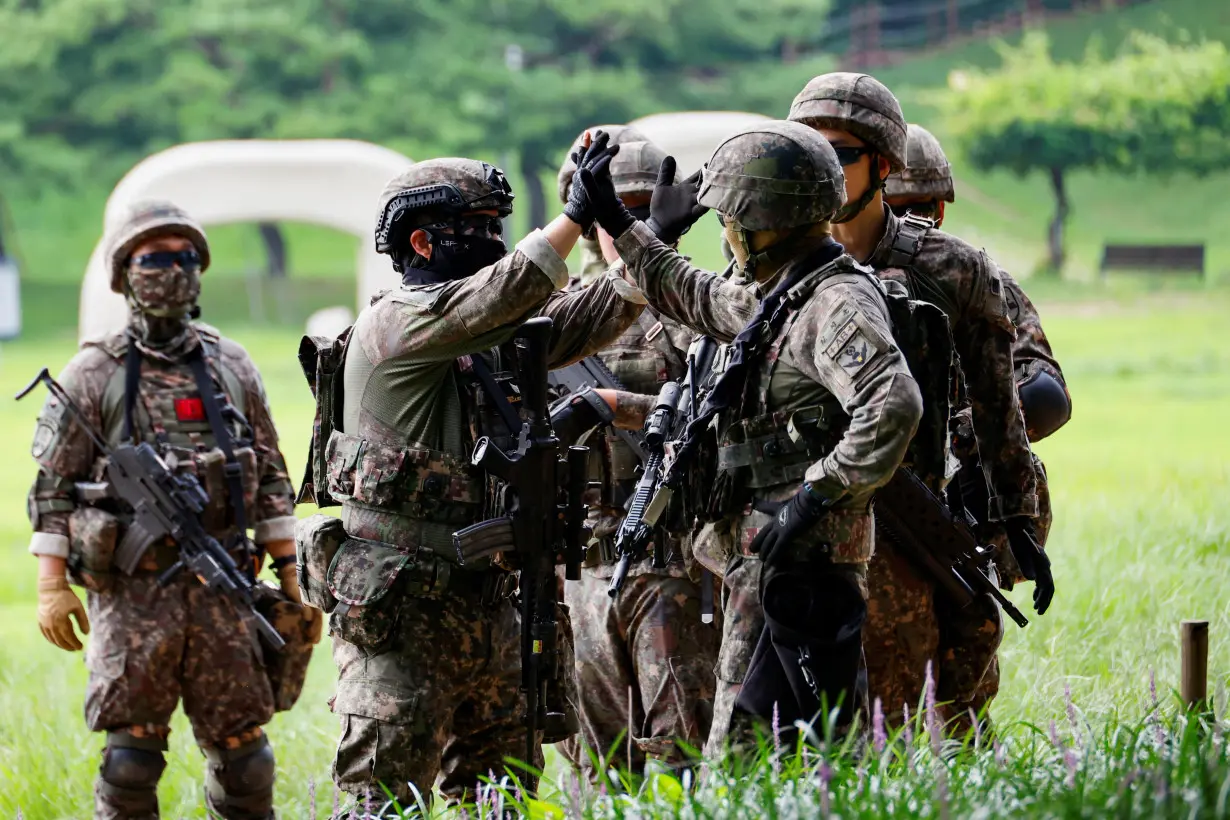 Soldiers take part in an anti-terror attack drill, in Seoul