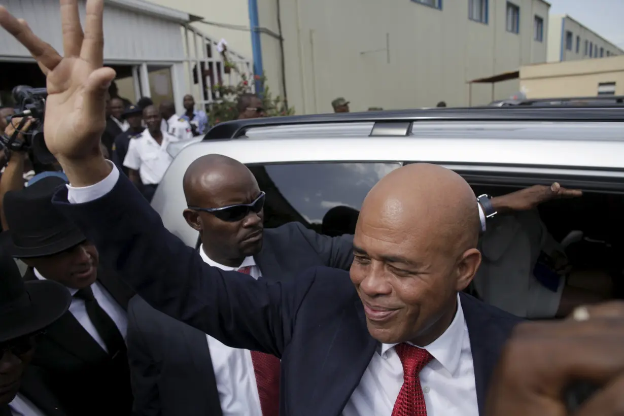 Martelly says goodbye after a ceremony marking the end of his presidential term, at the Haitian Parliament in Port-au-Prince, Haiti