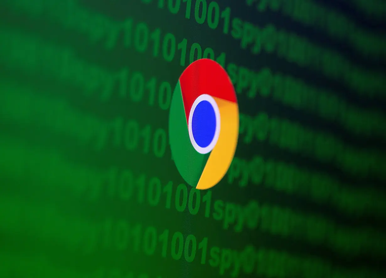 FILE PHOTO: Google Chrome logo is seen near cyber code and words 