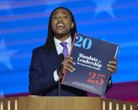 Throwing the book: Democrats enlarge a copy of the 'Project 2025' blueprint as an anti-GOP prop