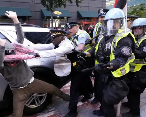 Pro-Palestinian protesters clash with police near Chicago's Israeli consulate on second night of DNC