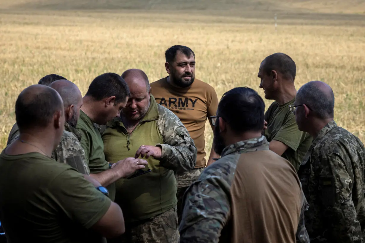 FILE PHOTO: Ukrainian soldiers train in the Sumy region near the Russian border