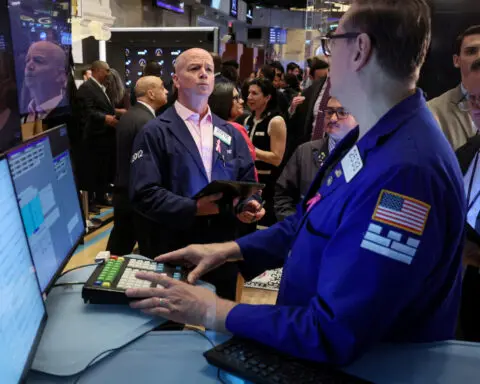 Wall St ends higher as Fed minutes, jobs data firm rate-cut hopes