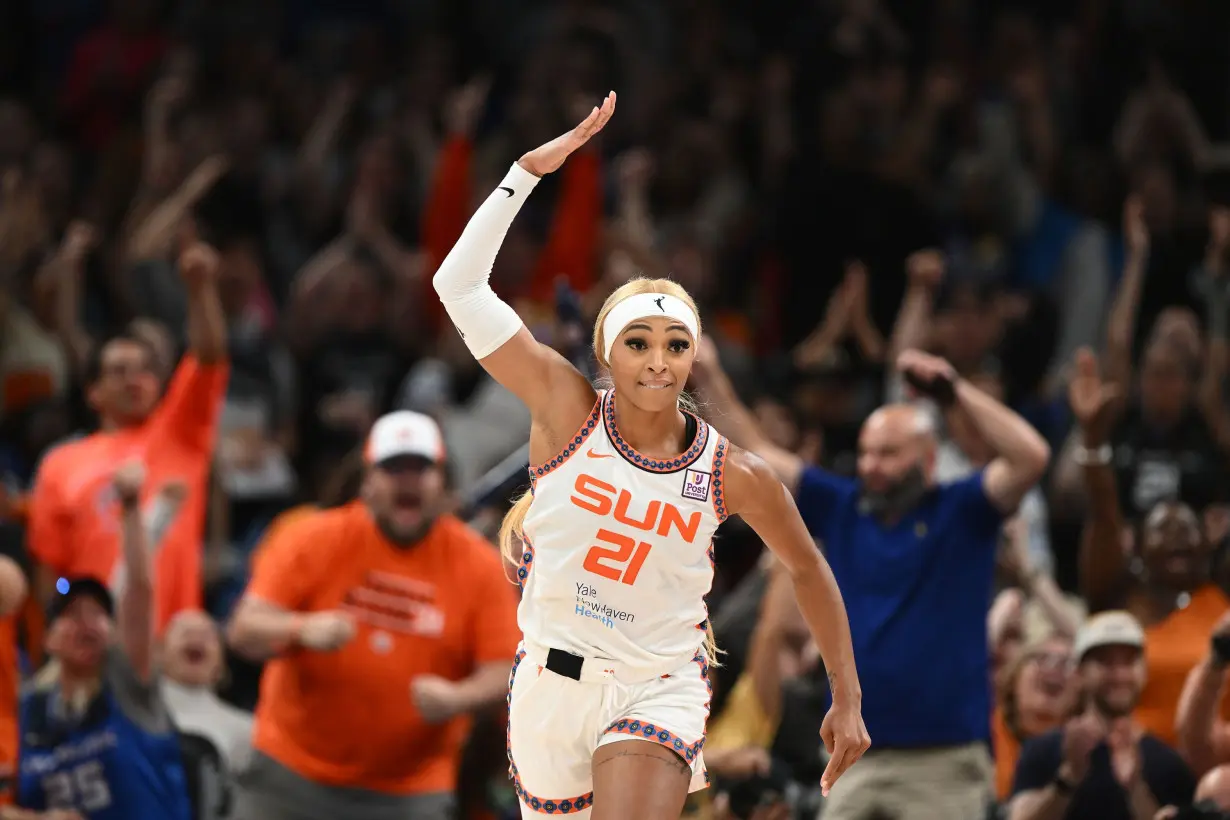 Carrington celebrates during the Sun's win against the Sparks.