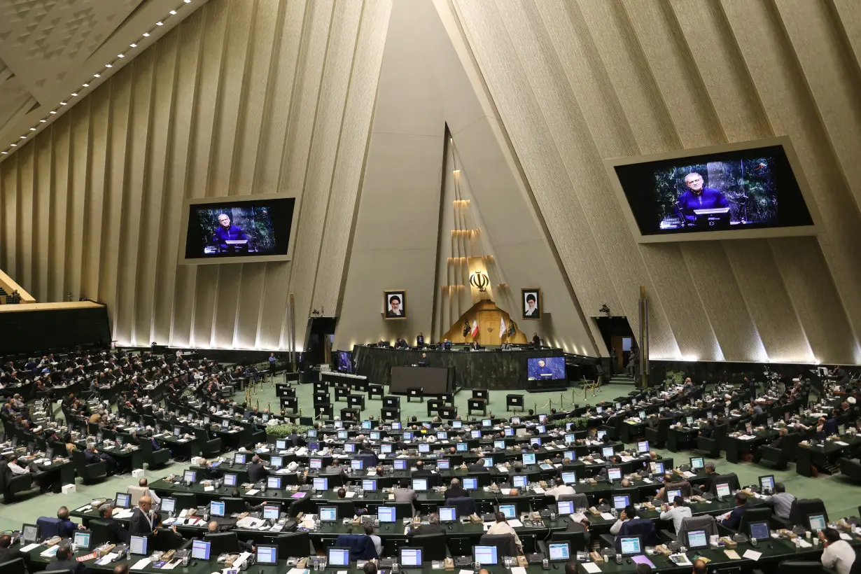 Iran's President Masoud Pezeshkian speaks in defence of his cabinet selection at the parliament in Tehran