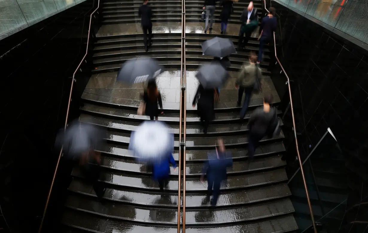 Commuters arrive to the Central Business District at the morning rush hour in Sydney