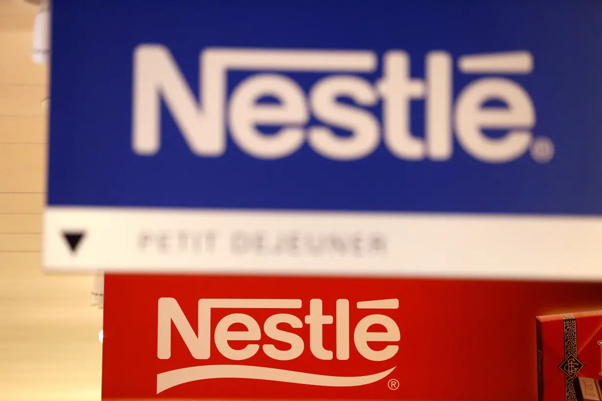 FILE PHOTO: Nestle logos are pictured in the supermarket of Nestle headquarters in Vevey