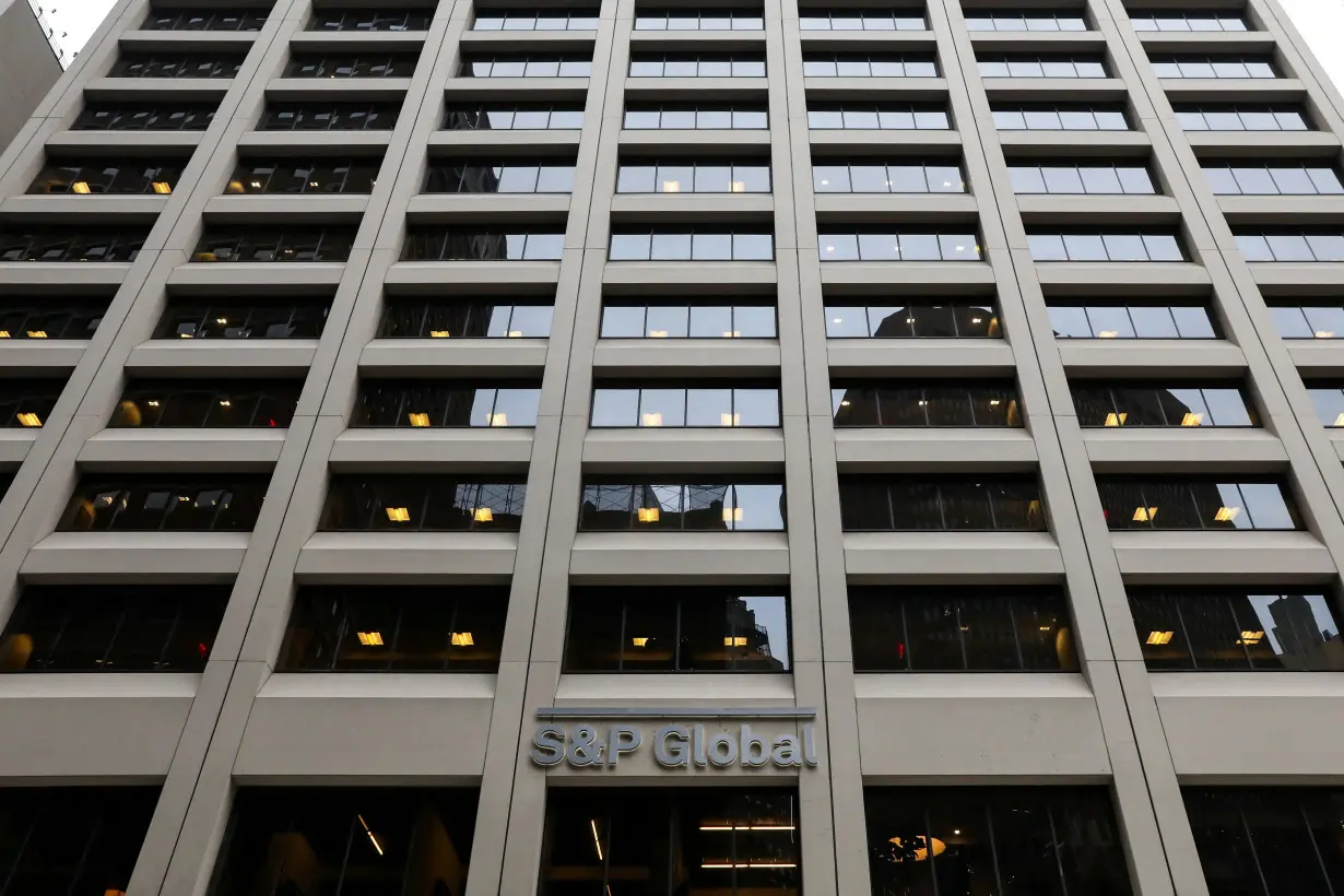 FILE PHOTO: The S&P Global logo is displayed on its offices in the financial district in New York