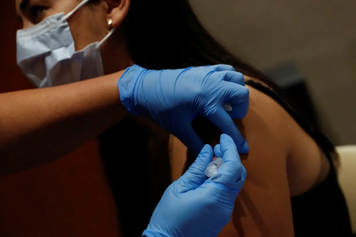 FILE PHOTO: A nurse applies a dose of COVID-19 vaccine in Sarasota