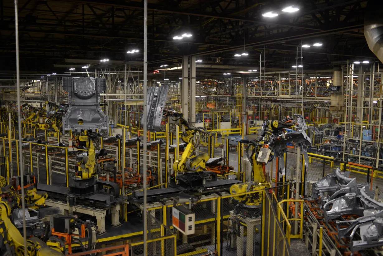 Robotic arms bring together car frames for welding at Nissan Motor Co's automobile manufacturing plant in Smyrna Tennessee