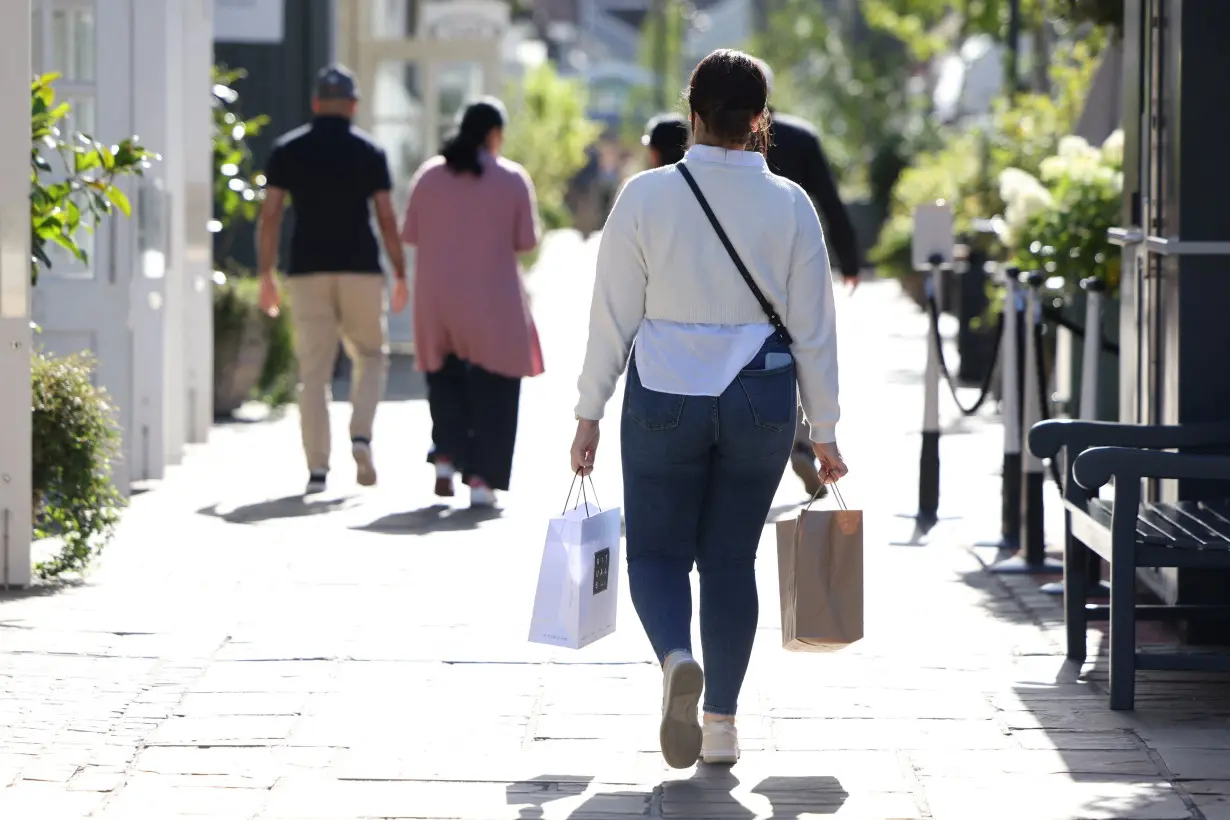 People shop at designer outlet stores at Bicester Village