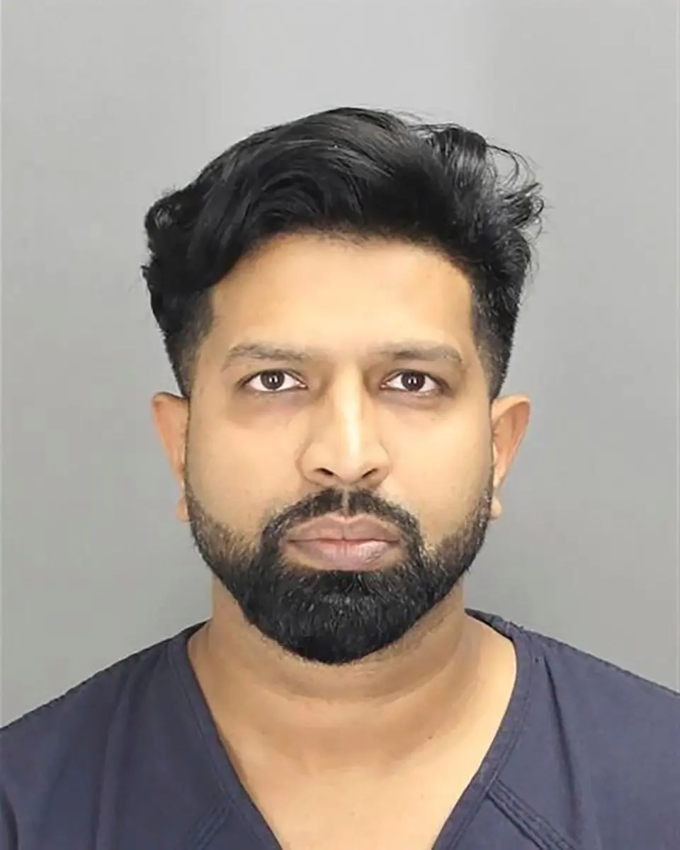 Michigan doctor accused of filming and abusing 'broad' array of victims, including children