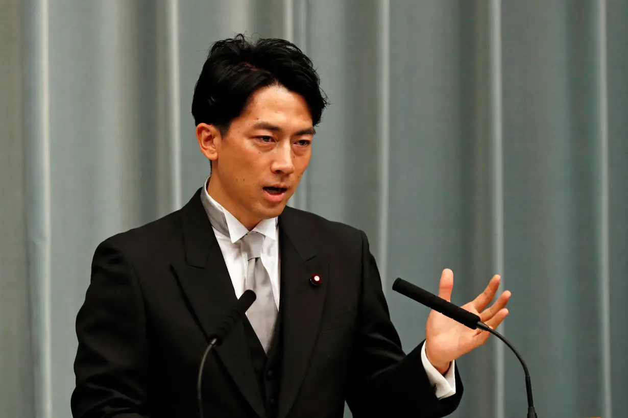 FILE PHOTO: Japan's Environment Minister Shinjiro Koizumi speaks at a news conference in Tokyo